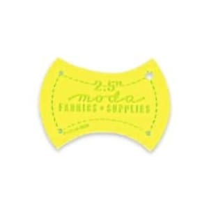 May include: Yellow plastic template for quilting with a 2.5 inch measurement and the text "Moda Fabrics & Supplies" printed on it.