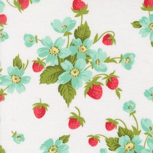 May include: A white fabric featuring a repeating pattern of light blue flowers with yellow centers, green leaves, and small red strawberries. The design is arranged in clusters of blossoms and fruit, creating a consistent botanical print.