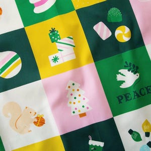 May include: A fabric pattern featuring a grid of squares in shades of green, yellow, pink, and white. The squares contain illustrations of holiday items including a squirrel, a Christmas tree, wrapped gifts, ornaments, candy, and a dove with the word PEACE.