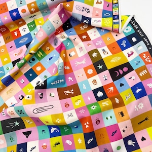 May include: Colorful fabric with a repeating pattern of small squares, each containing a unique graphic. The squares are in various colors, including pink, blue, yellow, and brown. The fabric has the text "RUBY STAR SOCIETY" and "by adonis marcelli chezz".