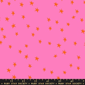 May include: Pink fabric with a repeating pattern of orange stars. The fabric has a ruler printed at the bottom with the text "RUBY STAR SOCIETY".
