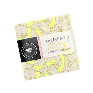 May include: A stack of 42 fabric squares labeled Memento by Carolyn Friedlander for Ruby Star Society. The fabric features a pattern of abstract shapes in neon yellow and light beige with thin brown outlines. A paper band indicates a 5 inch size.
