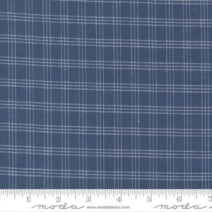 May include: Blue and white plaid fabric with a subtle texture. The fabric is shown with a ruler for scale.