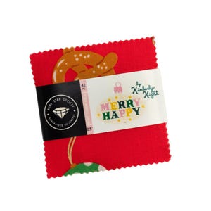 May include: A stack of 42 red fabric squares, each 2.5 inches, with a festive pretzel design. A black label reads "Ruby Star Society" and "Merry Happy" in a colorful design by Kimberly Kight.
