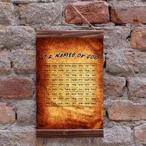 May include: A brown wooden scroll with a parchment-like background and the text "72 NAMES OF GOD" in black lettering. The scroll is filled with Hebrew text in a grid format.