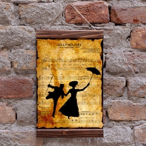 Op de afbeelding: Een vintage-stijl print van bladmuziek met een silhouet van een dansend stel. De muziek is getiteld "Jolly Holiday" en de print is ingelijst in een bruin houten lijst.