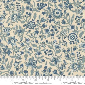 May include: Cream-colored fabric with a repeating floral pattern in shades of blue. The design features stylized flowers, leaves, and vines, creating a classic, elegant look. The fabric is suitable for quilting, apparel, or home decor projects.