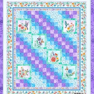 May include: A quilt pattern featuring a whimsical design of hummingbirds and butterflies flying amongst flowers. The pattern is called "Fanciful Flight" and is designed by Lori Siebert. The quilt is 72 1/2 inches by 86 1/2 inches.