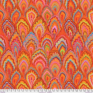 May include: A vibrant fabric with a repeating pattern of stylized, flame-like shapes in shades of orange, red, pink, blue, and green. The design has a retro, psychedelic feel, with a ruler along the bottom edge.
