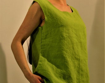 May include: A sleeveless, lime green linen top with a scoop neck. The top is loose fitting and has a relaxed, casual style.