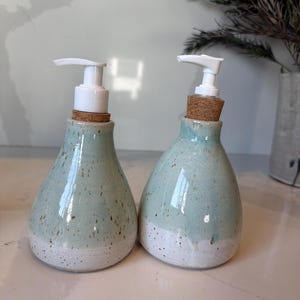 Handmade ceramic soap dispenser set for kitchen or bathroom, designed for everyday use and durability.