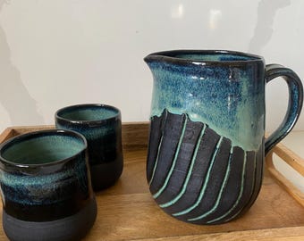 ceramic watering can with two cups. Ceramic water pitcher