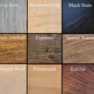 May include: Nine wood stain samples, each labeled with its name: Gray Stain, Weathered Oak, Black Stain, Early American, Espresso, Special Walnut, Natural Wood, Fruitwood, and Red Oak.