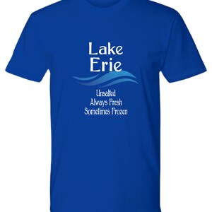 May include: A royal blue t-shirt with a white graphic design that says "Lake Erie Unsalted Always Fresh Sometimes Frozen".