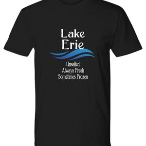 May include: Black t-shirt with a white graphic that says "Lake Erie" with a blue wave design underneath. The text below the wave says "Unsalted Always Fresh Sometimes Frozen".