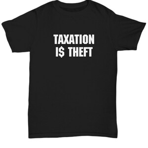 May include: Black t-shirt with white text that reads "Taxation is $ Theft".
