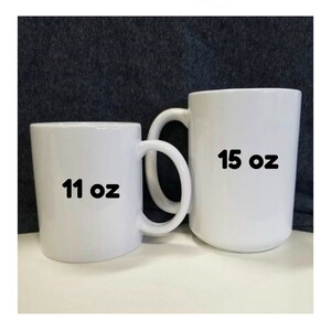 May include: Two white ceramic mugs, one is 11 ounces and the other is 15 ounces.
