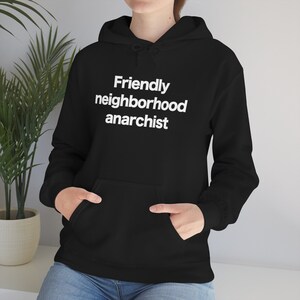 May include: Black hoodie with a white print that says "Friendly neighborhood anarchist".