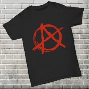 May include: Black t-shirt with a red anarchy symbol printed on the front.