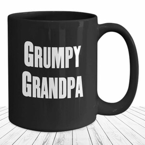May include: Black coffee mug with white text that reads "GRUMPY GRANDPA".