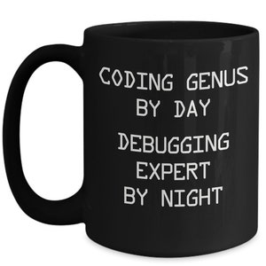 May include: Black coffee mug with white text that reads "Coding Genius by Day Debugging Expert by Night".