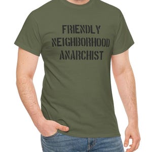 May include: A green t-shirt with the text "FRIENDLY NEIGHBORHOOD ANARCHIST" printed in black.