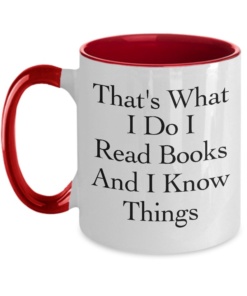 May include: White ceramic coffee mug with a red rim and handle. The mug has black text that reads "That's What I Do I Read Books And I Know Things."