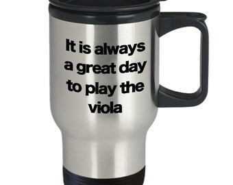 May include: A stainless steel travel mug with a black lid and handle. The mug has the text "It is always a great day to play the viola" printed on it.
