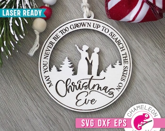 May include: A white wooden Christmas ornament with the text "May you never be too grown up to search the skies on Christmas Eve". The ornament features a silhouette of a couple standing in a forest.