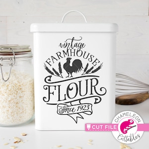 May include: White metal canister with a black and white design that says "vintage farmhouse flour since 1923". The design includes a rooster and wheat stalks.