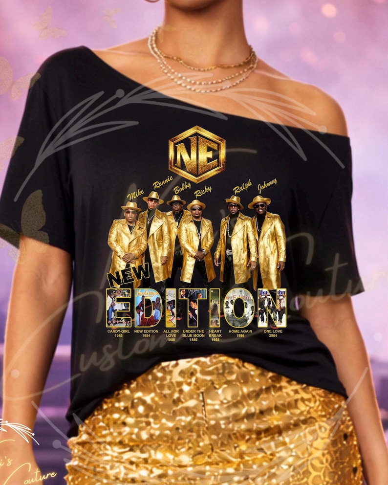 May include: Black t-shirt featuring a gold graphic of the music group New Edition. The graphic includes the group's name, members' names, and album titles. The shirt is paired with gold sequin shorts.