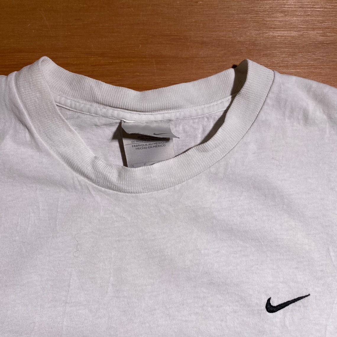 stacking checks nike shirt