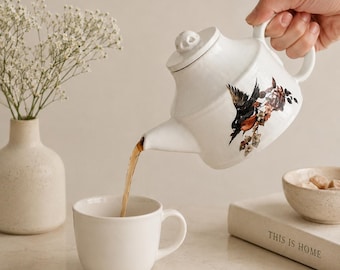Tetera de cerámica con diseño de pájaro cantor, hecha a mano.