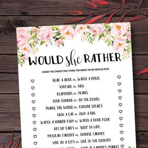 May include: A printable bridal shower game with a floral border. The game asks guests to guess which choice the bride would prefer in a series of "Would she rather..." questions.