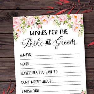 May include: A white card with pink floral borders and the text "WISHES FOR THE Bride Groom" with lines for writing wishes for a couple.