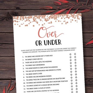 May include: A white paper game titled "Over or Under" with rose gold confetti and text. The game includes statements about the bride and groom, with space for answers. Perfect for a bridal shower or wedding activity.