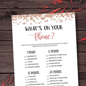 May include: A printable bridal shower game with a rose gold glitter background. The game is called "What's on your phone?" and asks players to check off items they have on their phone and add up the points. The game includes a list of items with point values ranging from 1 to 20 points.
