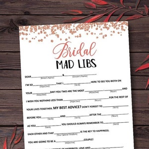 May include: A printable bridal mad libs game with a rose gold glitter background. The game features fill-in-the-blank sentences about the bride and groom.
