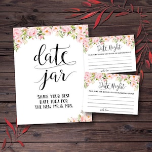 May include: A white date jar sign and two date night cards with floral accents. The date jar sign reads "date jar" and "Share your best date idea for the new Mr. & Mrs." The date night cards have lines for writing.