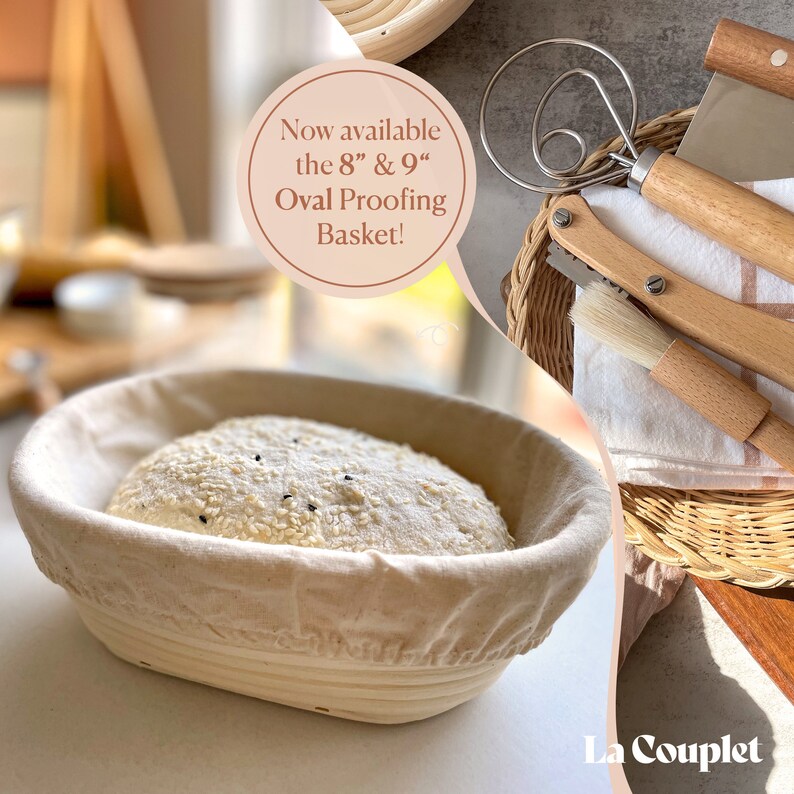 May include: An oval proofing basket with a linen liner holds a loaf of bread covered in sesame seeds. The image also shows a whisk, a bread lame, and a pastry brush. Text reads: "Now available the 8" & 9" Oval Proofing Basket!"