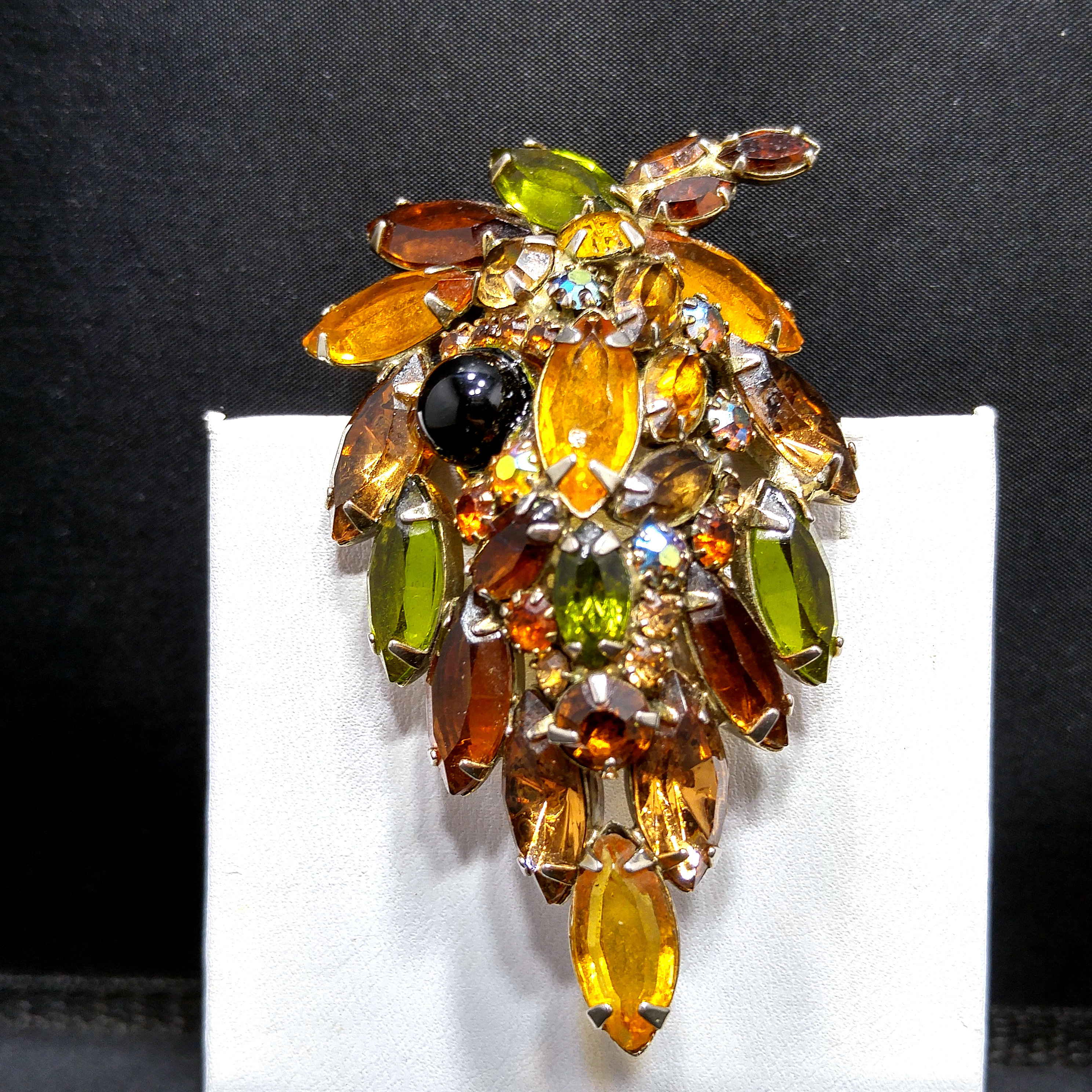Juliana Brooch with An Opalescent Glass Oval Cabochon, Dark Gray Rhinestones That Are The Color of Hematite, Yellow and Caramel Colored Rhinestones