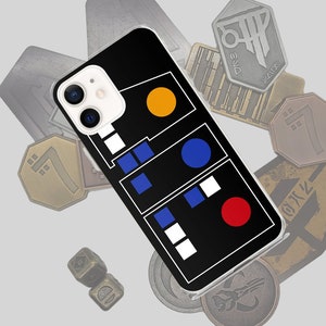 Puede incluir: Una funda para iPhone negra con un diseño blanco y negro que presenta un patrón de círculos amarillo, azul y rojo. La funda tiene un recorte para la cámara y un borde blanco.