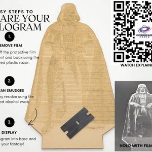 May include: A tan-colored hologram of Darth Vader with instructions for preparation. The image includes a plastic razor and the text "3 EASY STEPS TO PREPARE YOUR HOLOGRAM". A QR code and a smaller image of the hologram with the film removed are also present.