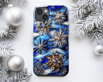 May include: A smartphone case featuring a vibrant blue and white swirling background adorned with intricate, multi-layered metallic gold and silver snowflake designs, accented with small embedded crystals throughout the pattern.