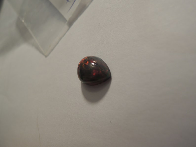 1.58ct solid Black Natural Opal 10 x 8 mm approximate never set Multi color sparks or color
