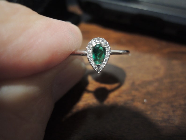 Sterling Halo Pear shaped ring Order in sterling white gold synthetic man-made gems or natural model is size 8