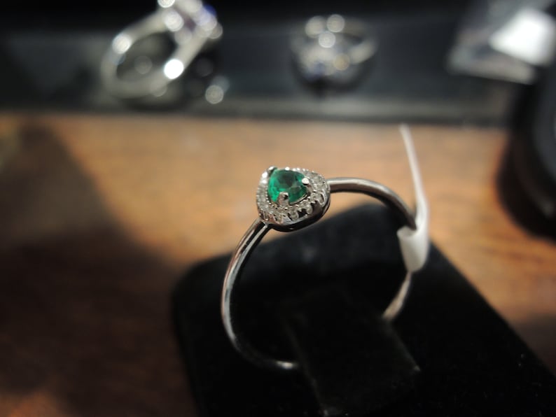 Sterling Halo Pear shaped ring Order in sterling white gold synthetic man-made gems or natural model is size 8
