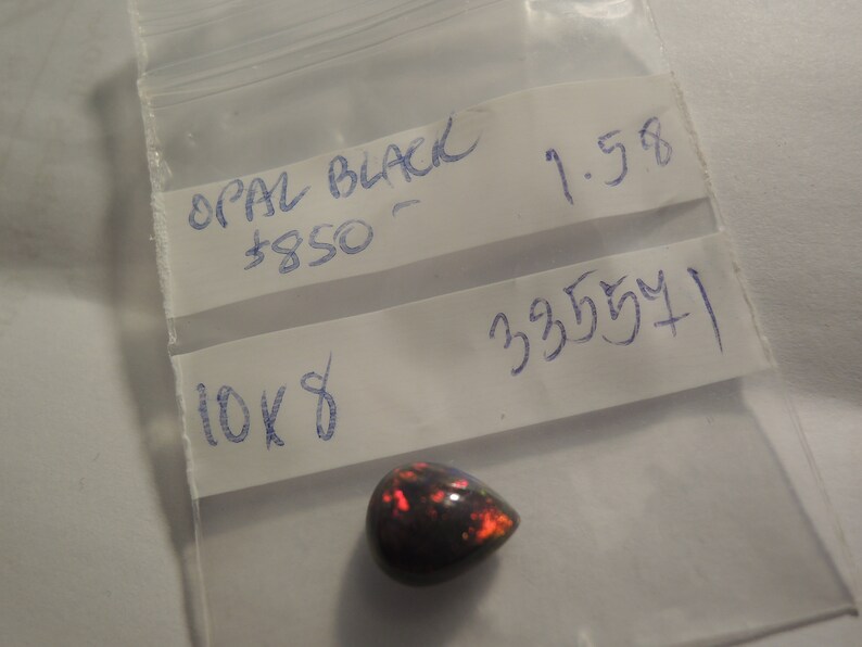 1.58ct solid Black Natural Opal 10 x 8 mm approximate never set Multi color sparks or color