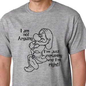 May include: A gray t-shirt with a black and white illustration of a cartoon character. The text on the shirt reads "I am not Arguing I'm just explaining why I'm right!"