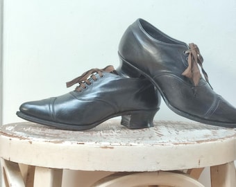 Antique black leather lace-up shoes